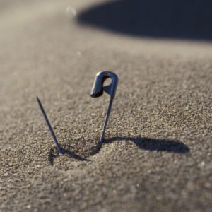 safety pin stuck in the carpet